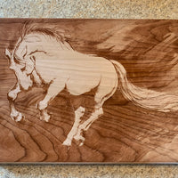 Andalusian leaping on a Cherry Cutting Board